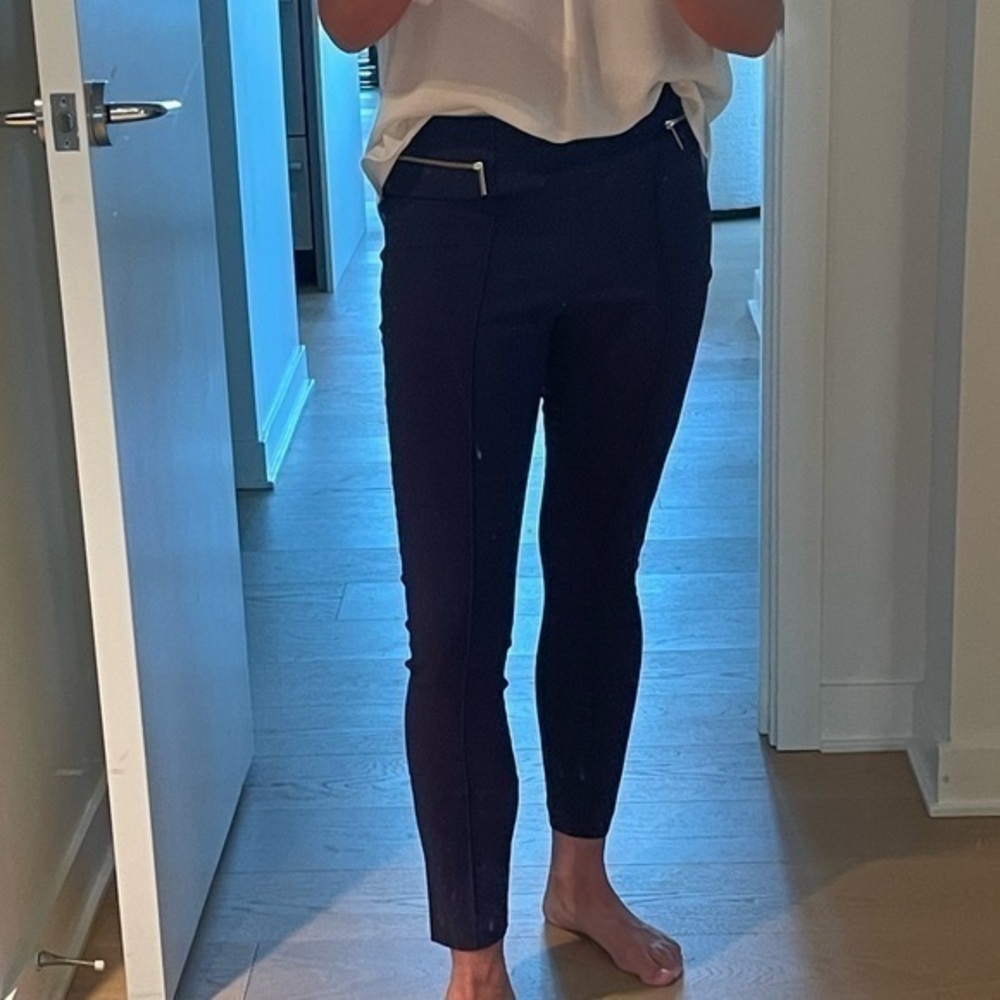 Michael Michael Kors pull on slim pants with seam and gold pocket detail.